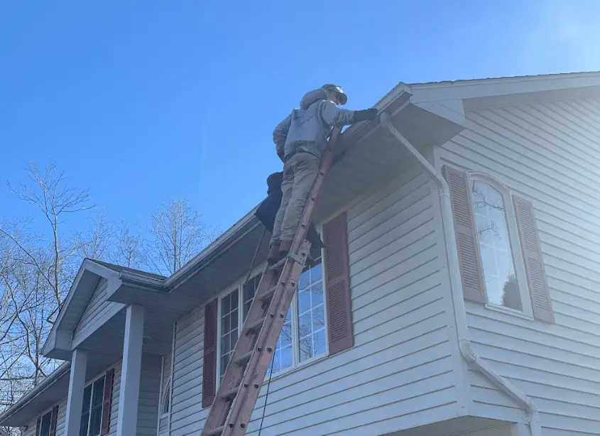 Gutter cleaning and maintenance being performed by Avon Lake Power Washing in Avon Lake
